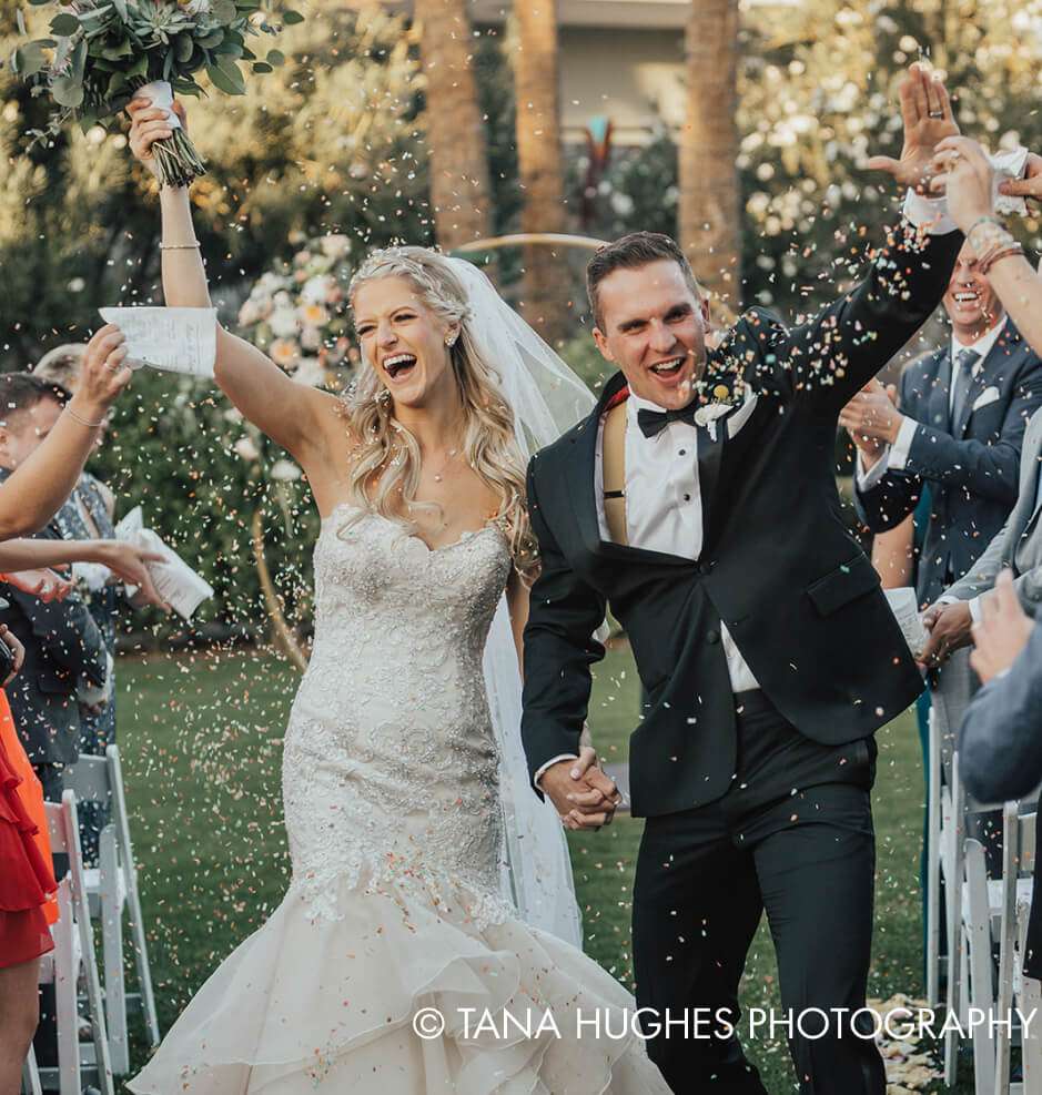 Bride and groom celebrating with smiles.