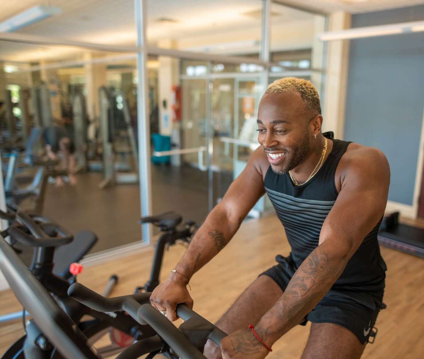 Hotel Valley Ho gym features a man on an exercise bike.