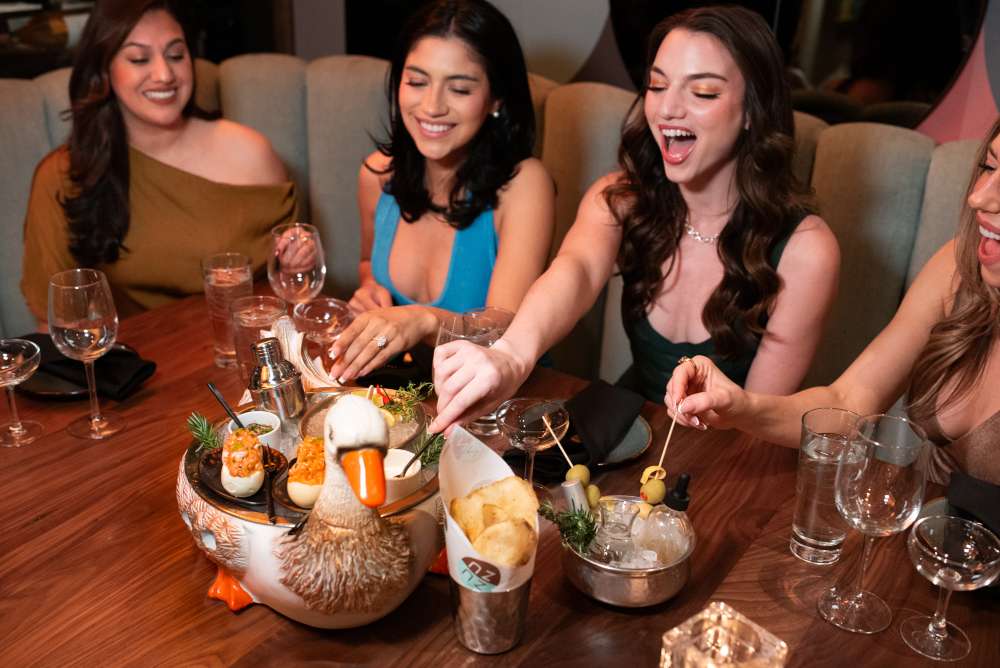four women eating at ZuZu restaurant