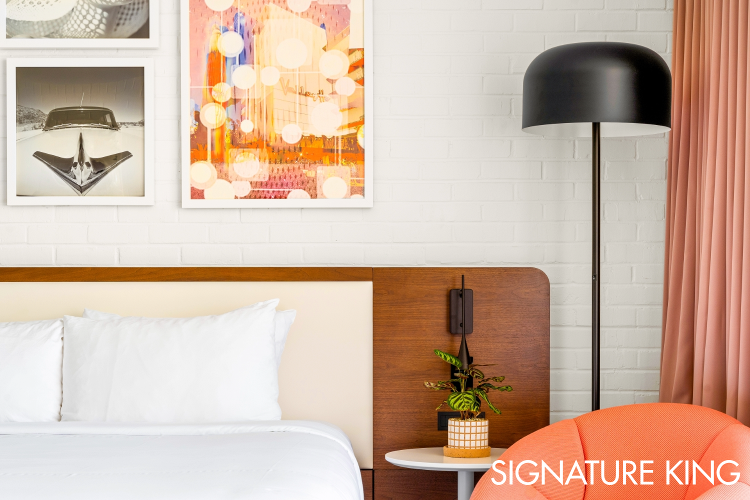 Signature King Guest Room detail; bed, chair and artwork