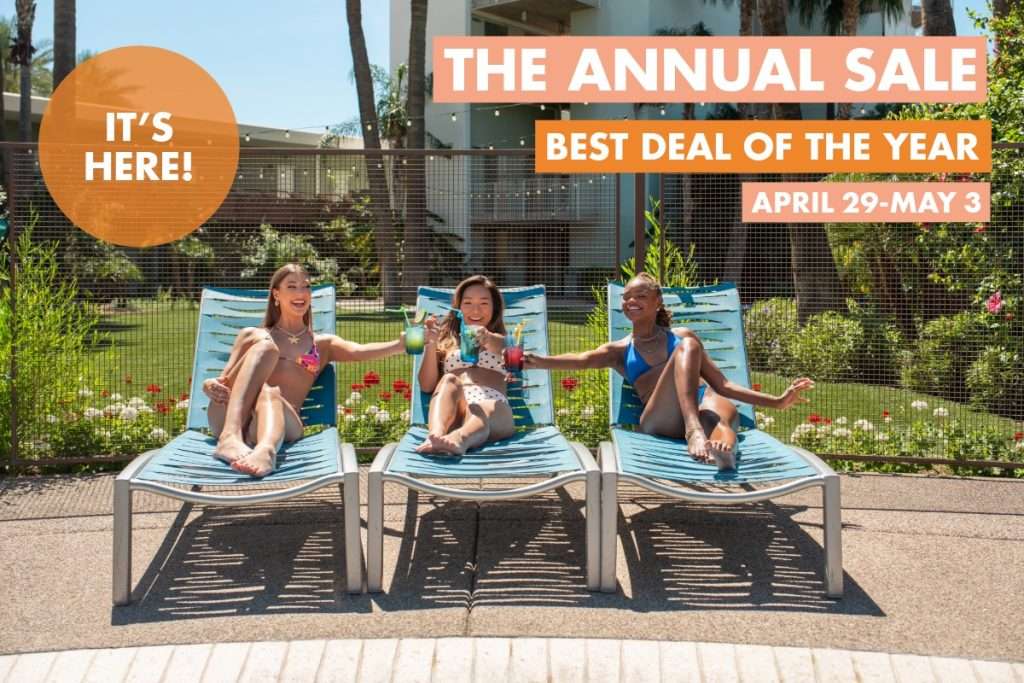 Annual Sale pop up with three women sitting on pool chairs cheersing cocktails