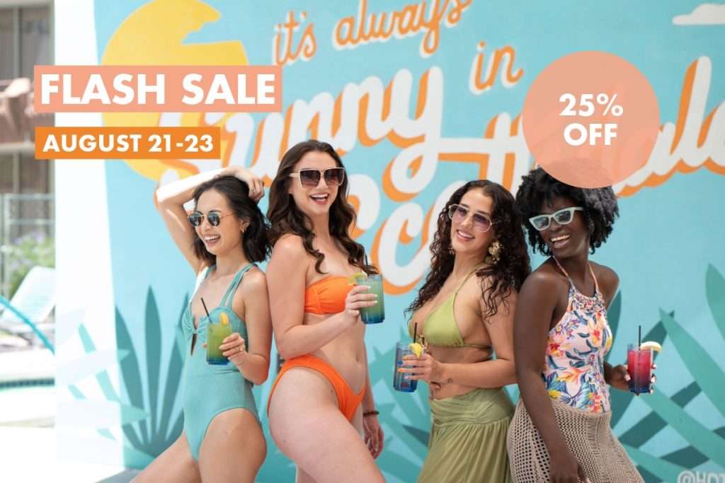 four women standing in front of OH Pool mural
