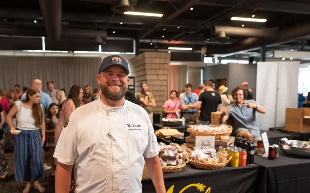 A chef smiling at the summer market.