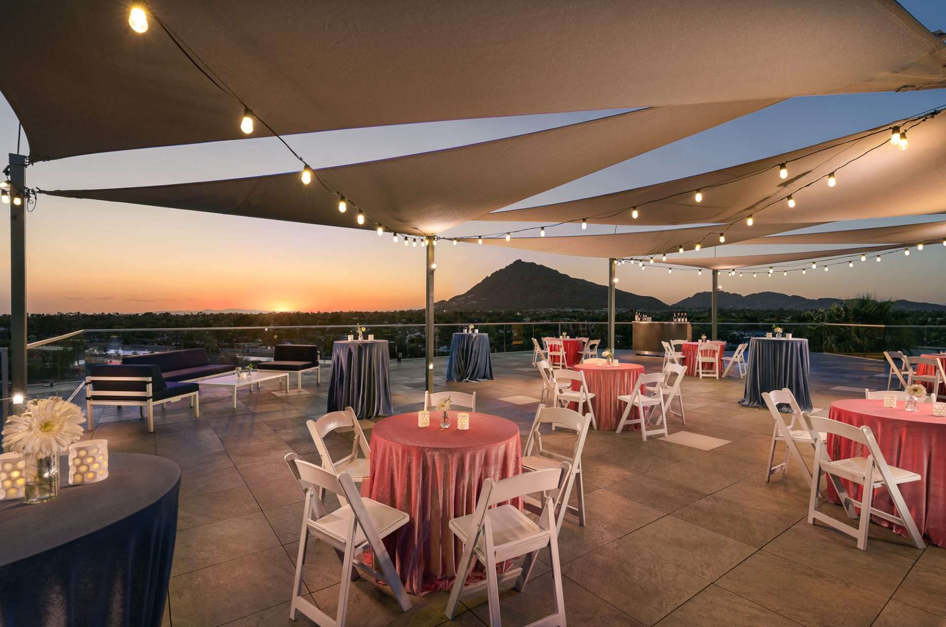 The Sky Line Rooftop featuring tables and chairs for an event set up