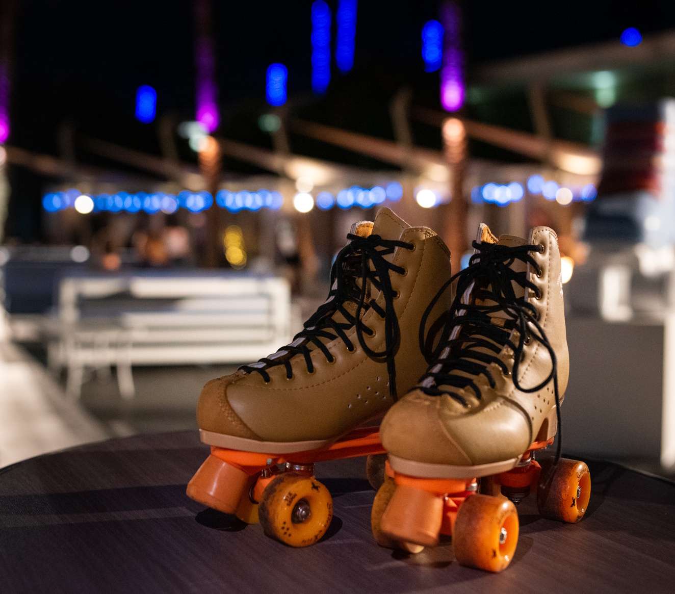 roller skates with rink in background