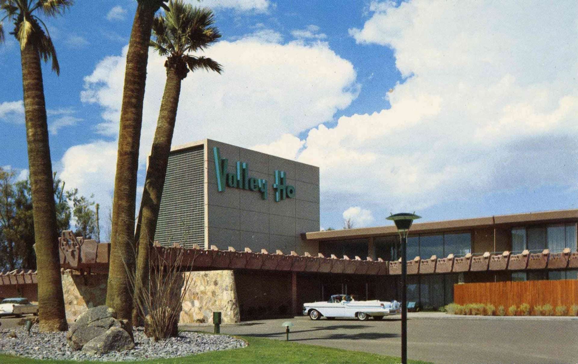 historic photo of the front of the hotel with the driveway and Valley Ho sign